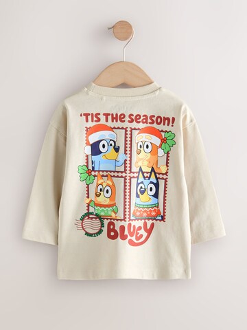 Tricou de la Next pe bej