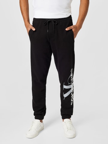 Calvin Klein Jeans Tapered Trousers in Black: front