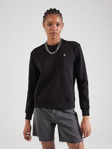 Sweat-shirt Calvin Klein Jeans en noir : devant