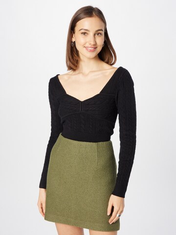 The Frolic Sweater in Black: front