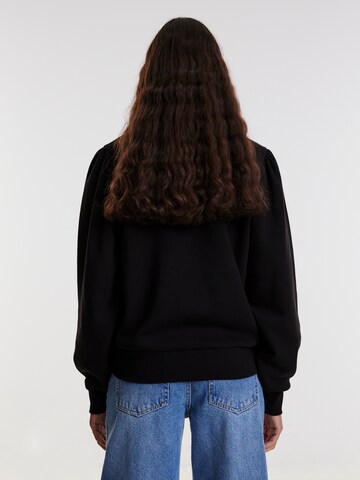 EDITED Sweatshirt 'Tamy' in Schwarz