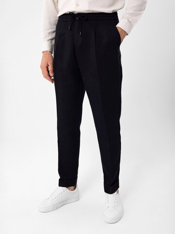 Antioch Tapered Pleat-Front Pants in Black