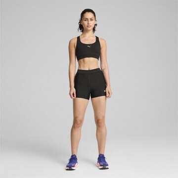 PUMA Skinny Sports trousers in Black