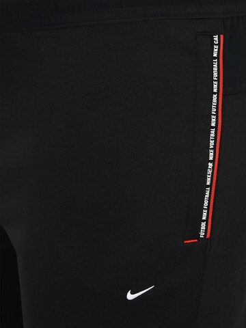 Effilé Pantalon 'F.C. Tribuna' Nike Sportswear en noir