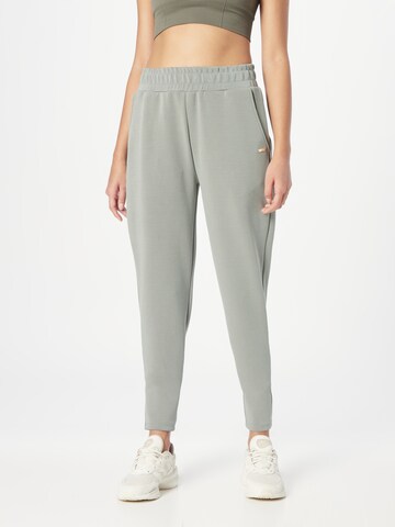 Athlecia Tapered Workout Pants in Green: front