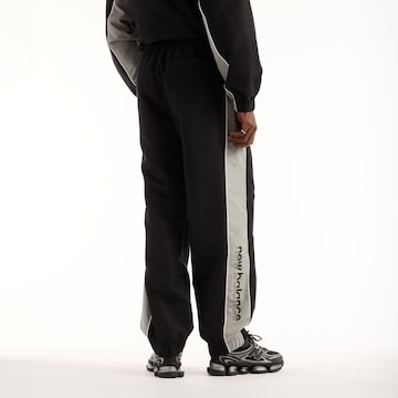 new balance - Tapered Pantalón en negro