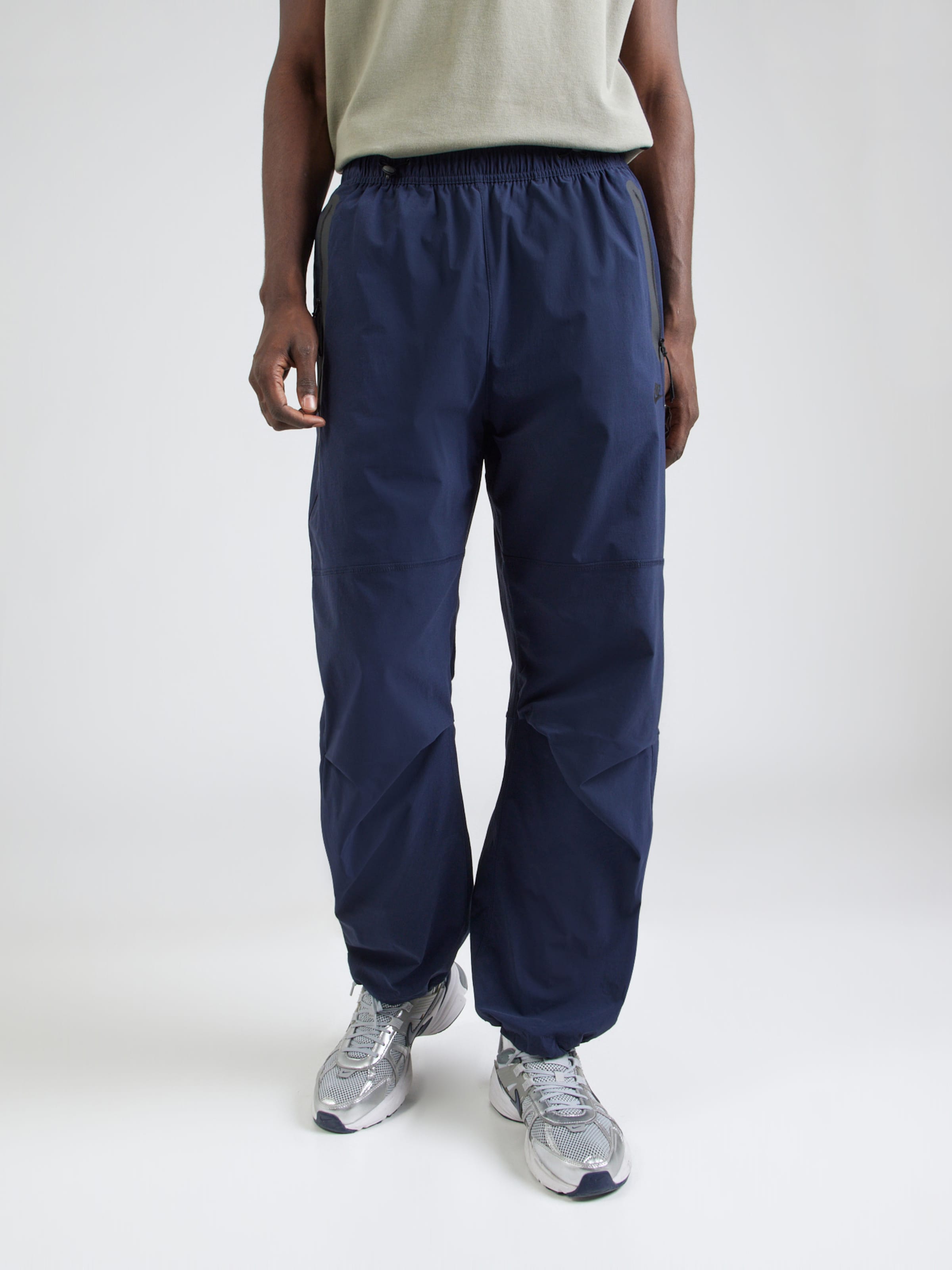 Nike Sportswear Baggy Pantaloni 'Tech' pe Bleumarin | ABOUT YOU