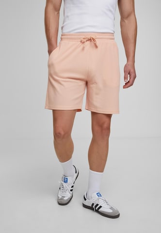 Urban Classics Loose fit Trousers in Orange