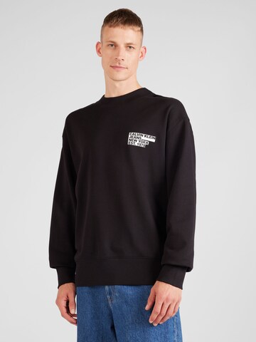 Sweat-shirt Calvin Klein Jeans en noir : devant