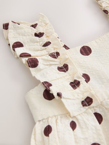 Ensemble Next en blanc