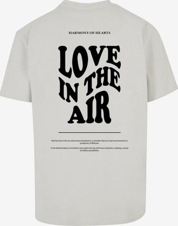 T-Shirt 'Love In The Air' Merchcode en gris