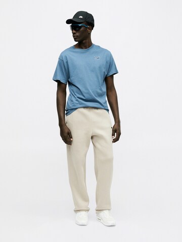 Regular Pantalon 'ATHL CLUB' Nike Sportswear en beige