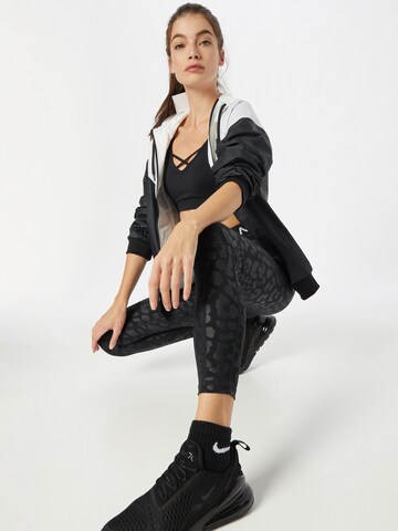 NIKE Skinny Sportbroek in Zwart