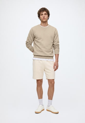 Regular Pantaloni de la Karl Kani pe bej