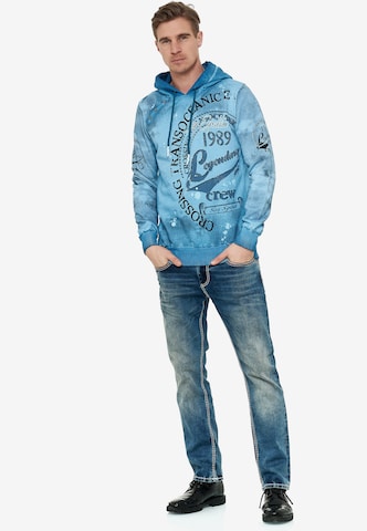 Rusty Neal Sweatshirt mit Streetwear Front Print in Blau