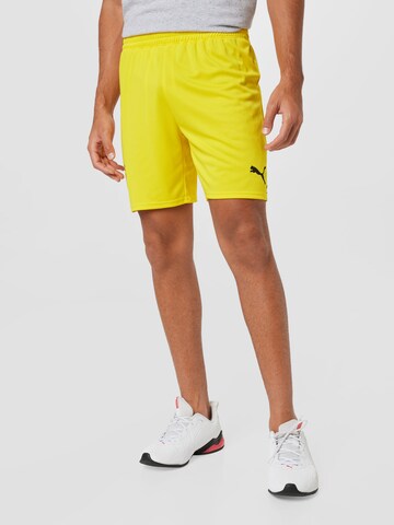 PUMA Štandardný strih Športové nohavice - Žltá: predná strana
