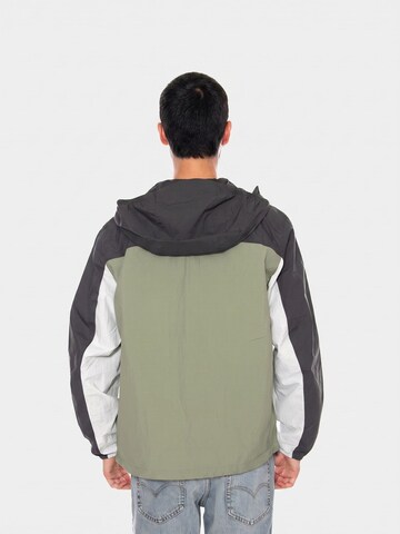 TOMMY HILFIGER Übergangsjacke 'TJM CHICAGO PACKABLE JACKET EXT SPRING OLIVE MULTI'‌‌‌‌‌‌‌ in Mischfarben