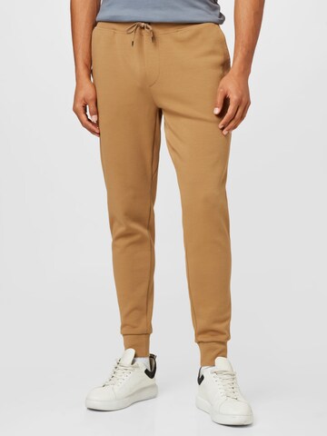 Polo Ralph Lauren Дънки Tapered Leg Панталон в бежово: отпред