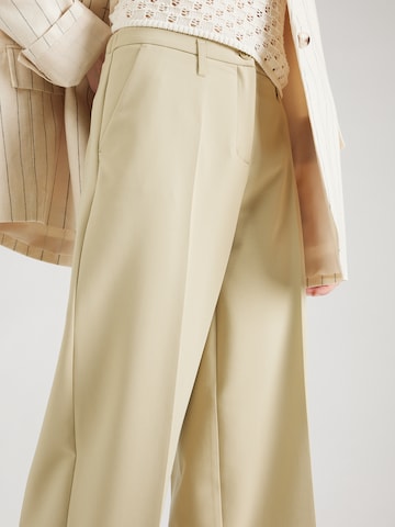 Wide leg Pantaloni con piega frontale di Summum in verde