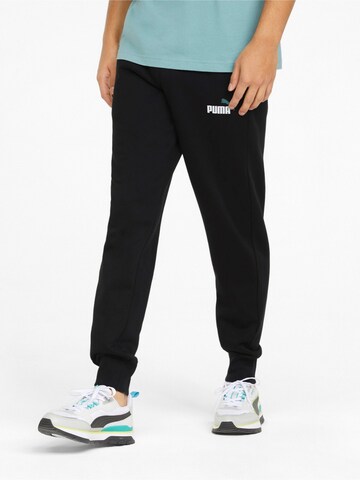 PUMA Tapered Sporthose 'ESS+' in Schwarz: Vorderseite