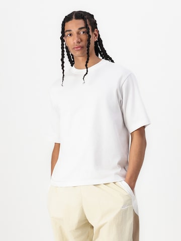 Nike Sportswear Baggy Kalhoty 'CLUB' – zelená