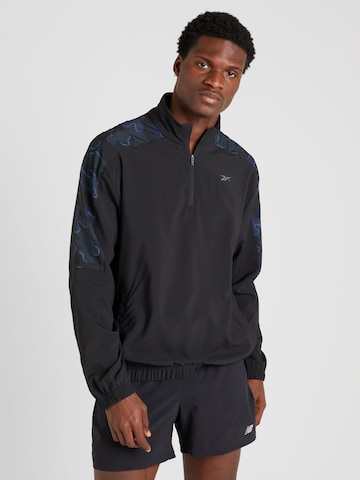 Reebok Sportsweatshirt 'TRAIN MOTION' i sort: forside