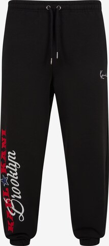 Karl Kani Tapered Pants in Black: front