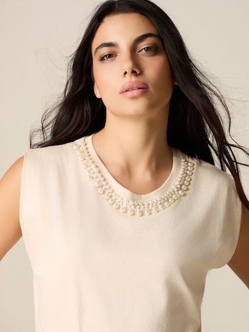 Haut oltre en beige