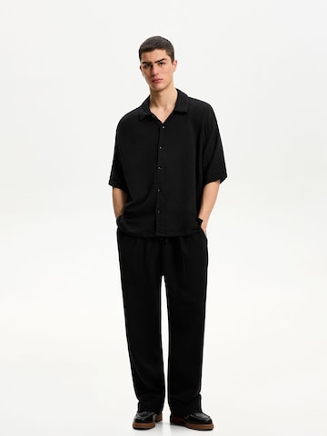 Wide leg Pantaloni di Bershka in nero
