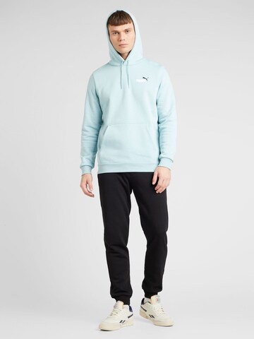 PUMASportska sweater majica 'ESS+' - plava boja