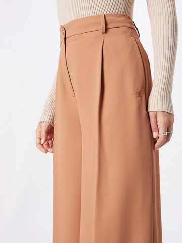 TOMMY HILFIGER Wide Leg Laskoshousut värissä oranssi