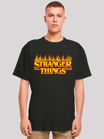 F4NT4STIC T-Shirt 'Stranger Things Fire Logo Netflix TV Series' in Schwarz: predná strana