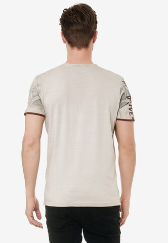 Rusty Neal T-Shirt mit lässigem Allover-Print in Beige