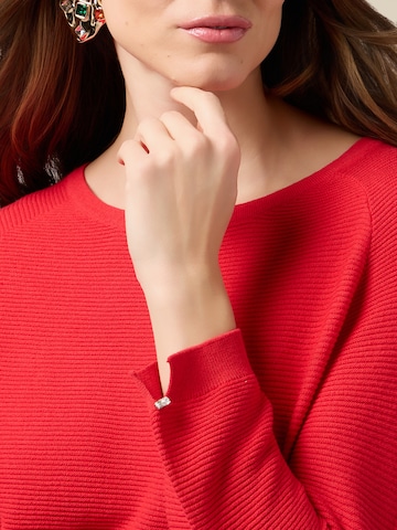 Pullover di oltre in rosso