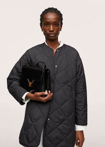 MANGO Prehodna jakna 'Cuscus' | črna barva