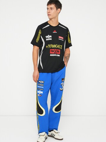 ADIDAS ORIGINALS - Loosefit Pantalón 'Teamgeist' en azul
