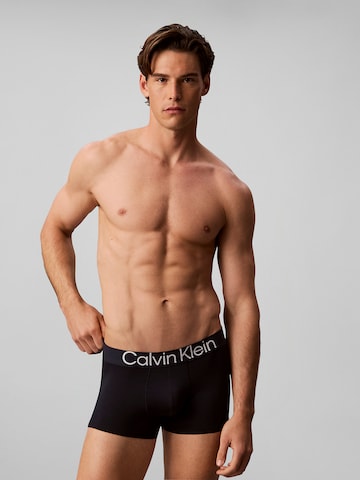 Boxeri de la Calvin Klein pe albastru: față