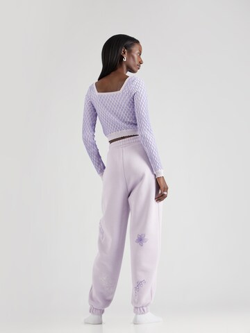 florence by mills exclusive for ABOUT YOU Tapered Trousers 'Lili' in Purple