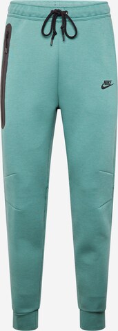 Pantaloni 'Tech Fleece' de la Nike Sportswear pe verde: față