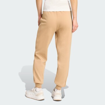 ADIDAS SPORTSWEAR - Tapered Calças de desporto 'Z.N.E.' em bege