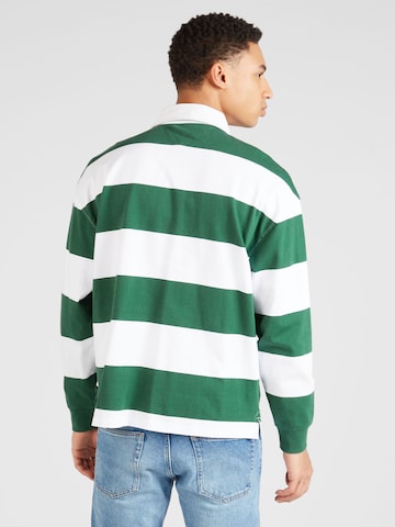 Tommy Jeans Μπλουζάκι 'VARSITY' σε πράσινο