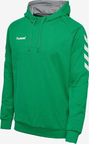 Hummel Urheilullinen collegepaita värissä vihreä