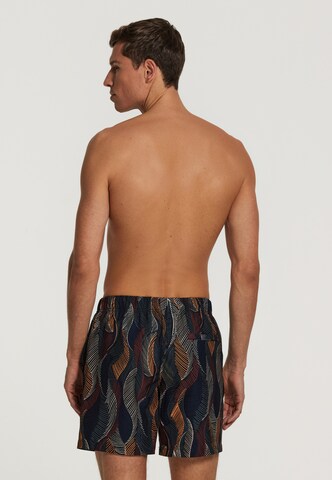 Shiwi Swimming shorts 'wild leaves 4-way stretch' in Black