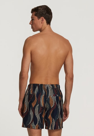 Shiwi Board Shorts 'wild leaves 4-way stretch' in Schwarz