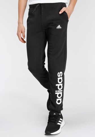 ADIDAS SPORTSWEAR - Tapered Calças de desporto 'Essentials Linear Logo' em preto: frente