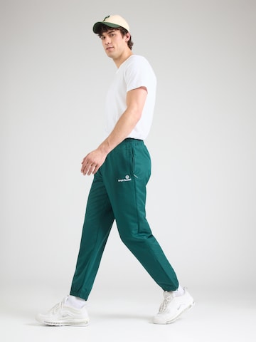 Sergio Tacchini Zwężany krój Spodnie sportowe 'Carson 021' w kolorze zielony
