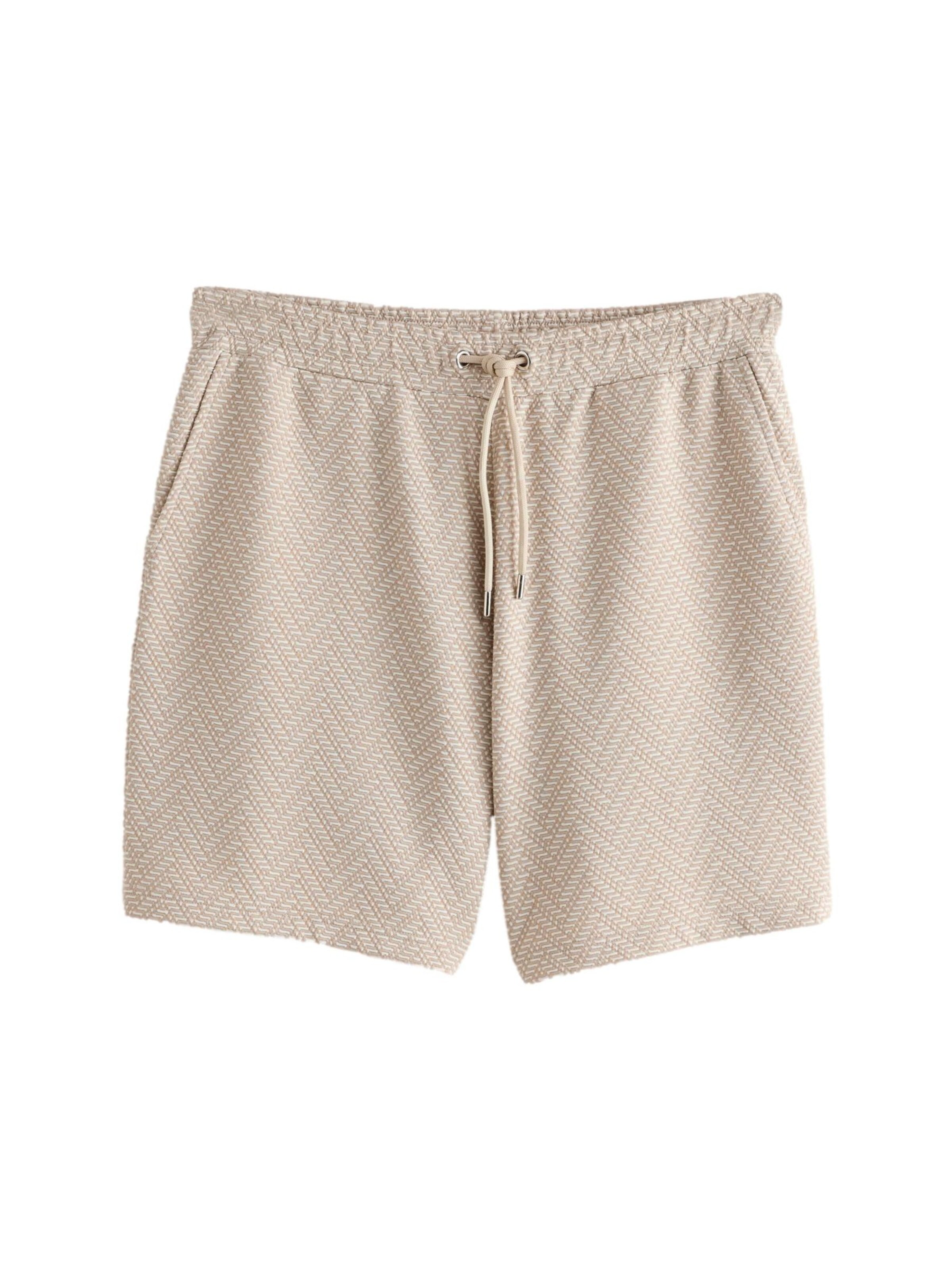 Next Regular Byxa i beige: framsida