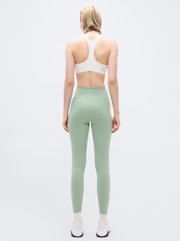 Skinny Pantalon de sport 'ONE' NIKE en vert