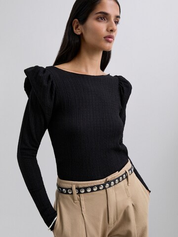 Scalpers Trikå ' ' i svart: framsida