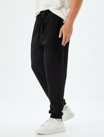 Koton Regular Trousers in Black: front